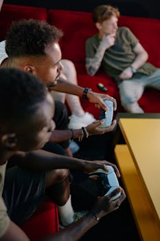 Three friends intensely playing video games together in a cozy indoor setup.